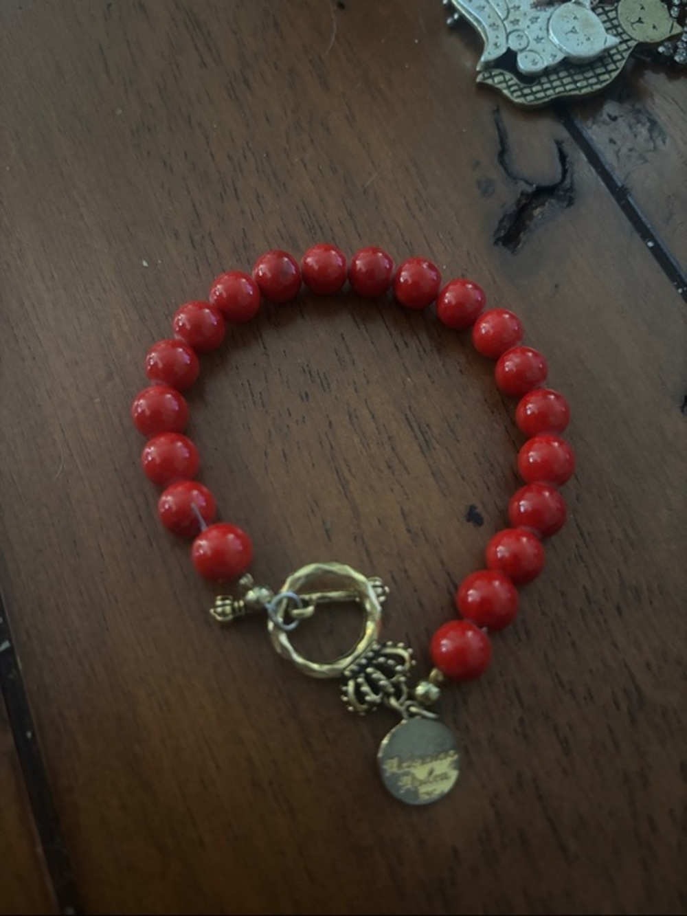 Gold-Accent Red Beaded Bracelet with Toggle Charm